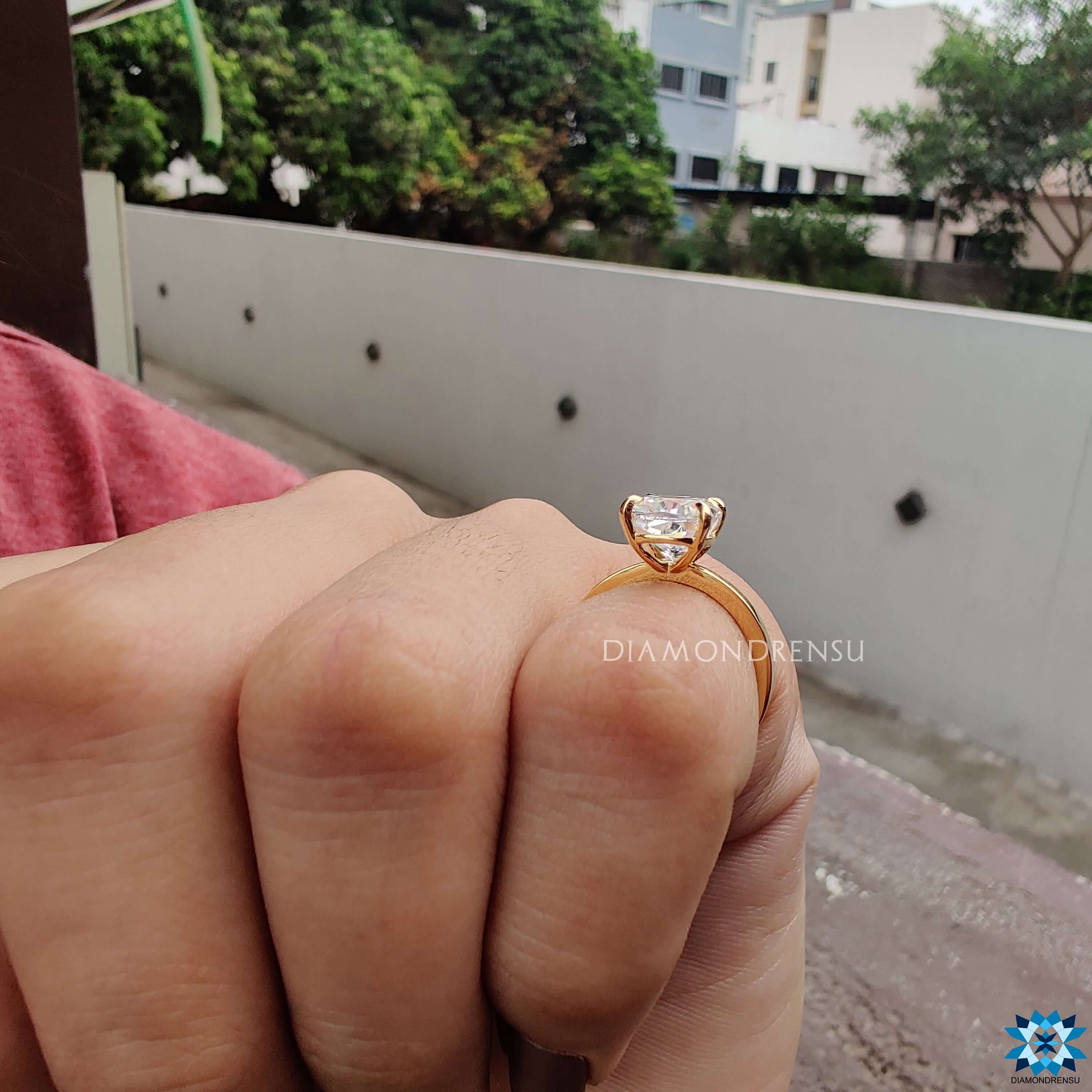 Handmade ring crafted in yellow gold with cushion solitaire moissanite.