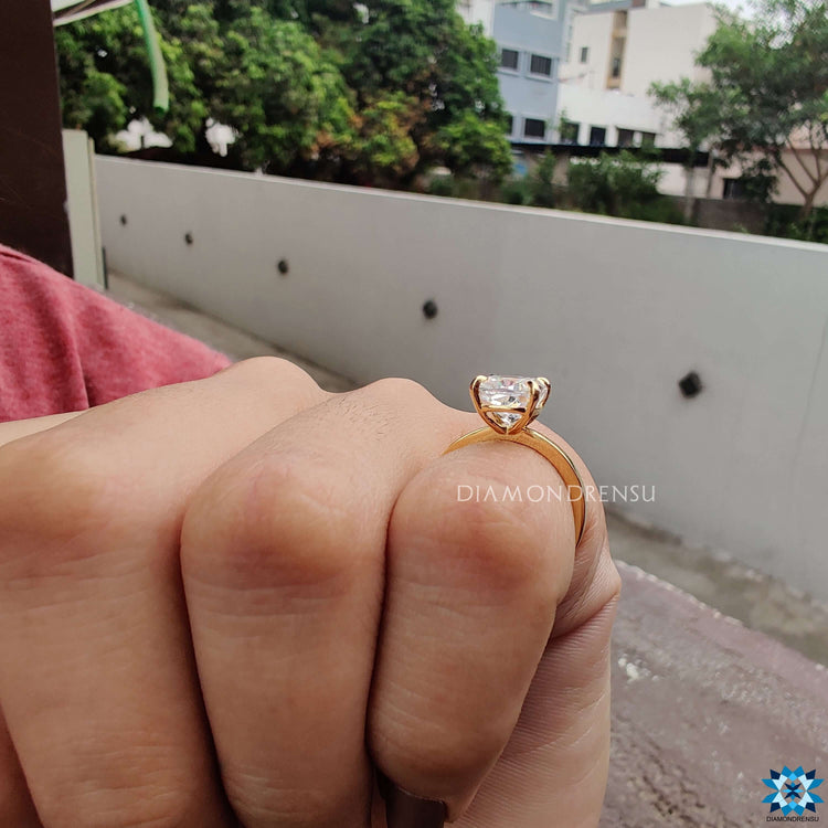Handmade ring crafted in yellow gold with cushion solitaire moissanite.