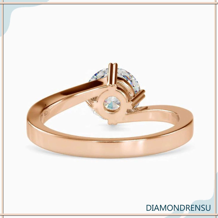 Lab grown diamond engagement ring with bypass solitaire design.