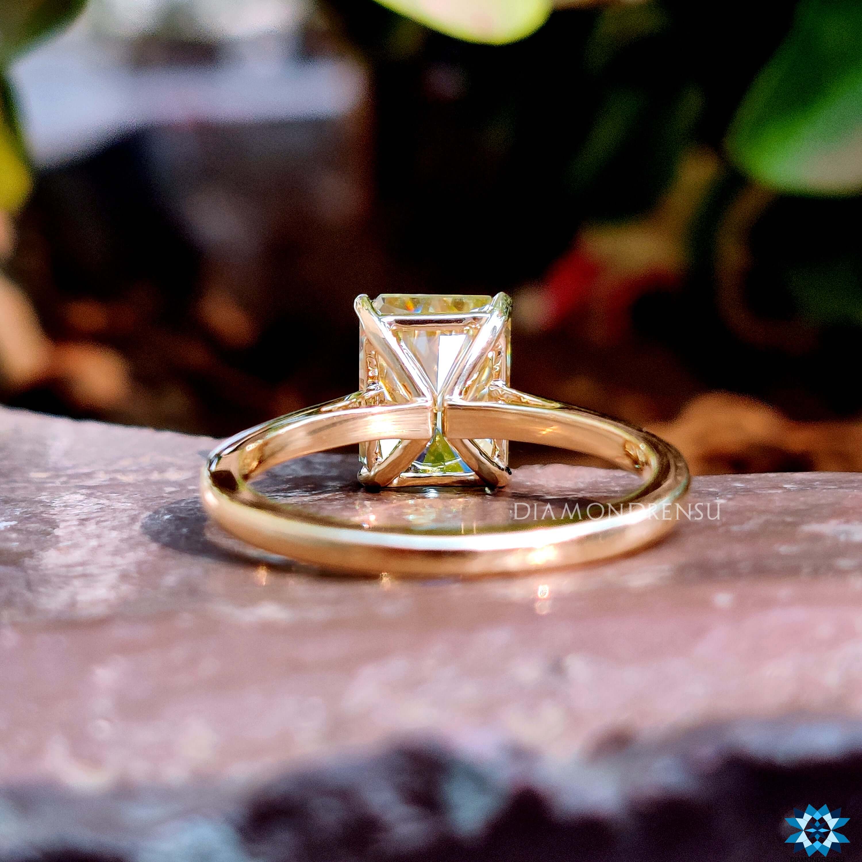 Handmade radiant engagement ring in prong setting.