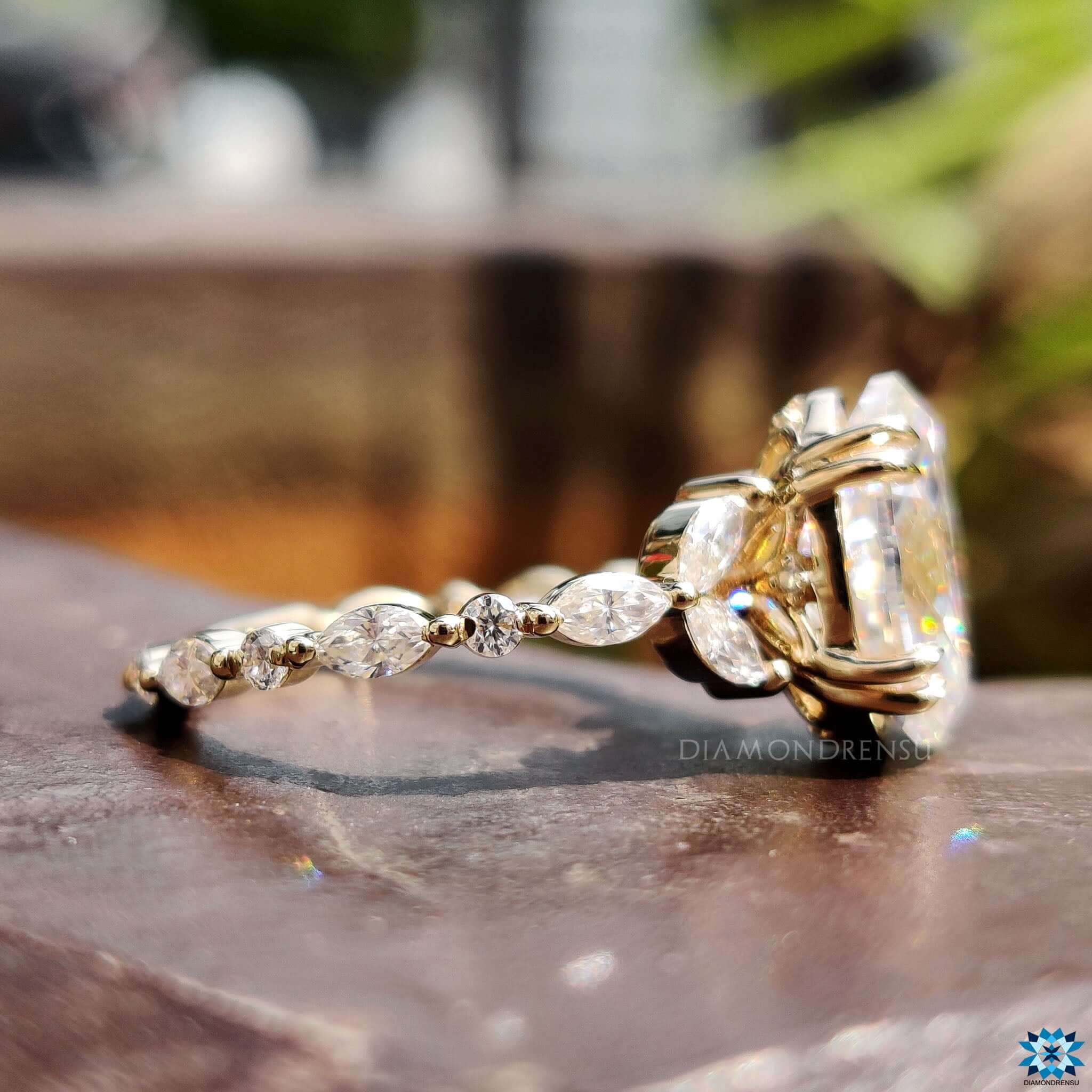 Custom yellow gold ring with tulip setting and Rensu cut moissanite.