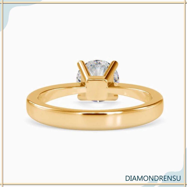 Yellow gold diamond ring in 4 prong basket setting, UK made.