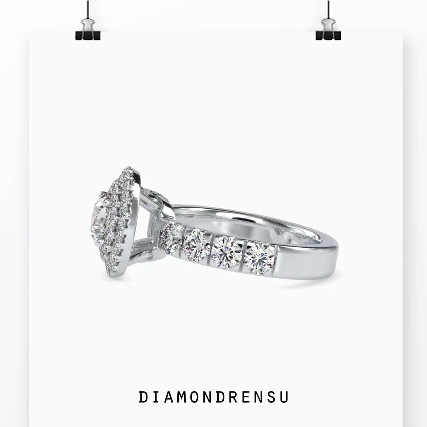 Diamondrensu UK engagement ring with halo and round prong setting.