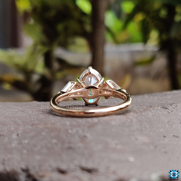 Handmade moissanite ring with kite cut side stones.