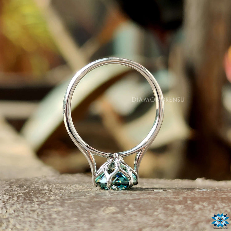 Buy moissanite tulip engagement ring with cyan blue stone.