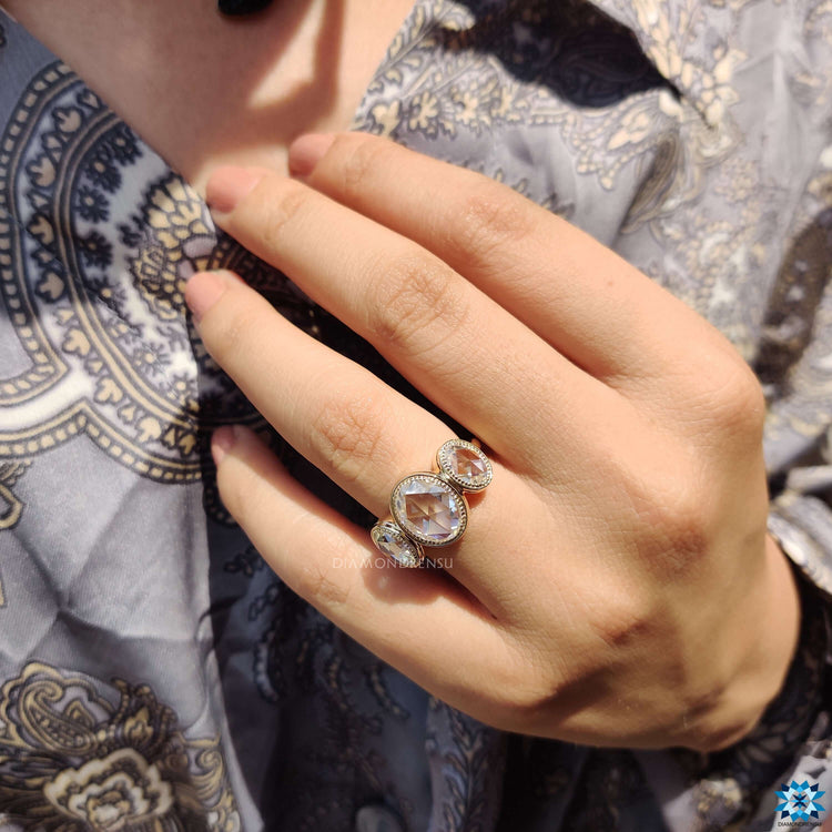 Yellow gold bezel set engagement ring.