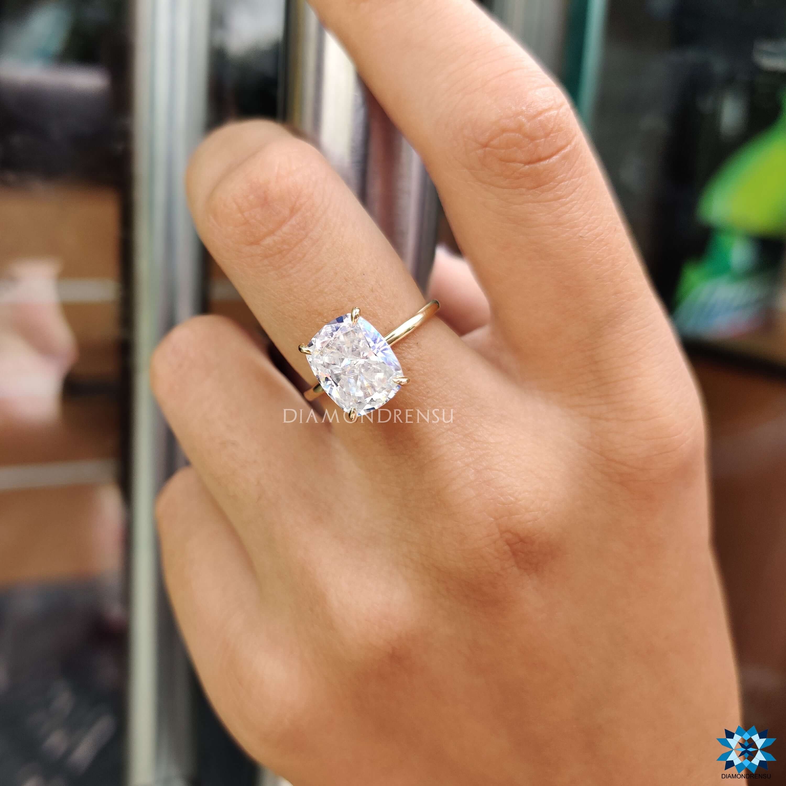 Handmade ring with crushed ice moissanite in a 4 prong setting.