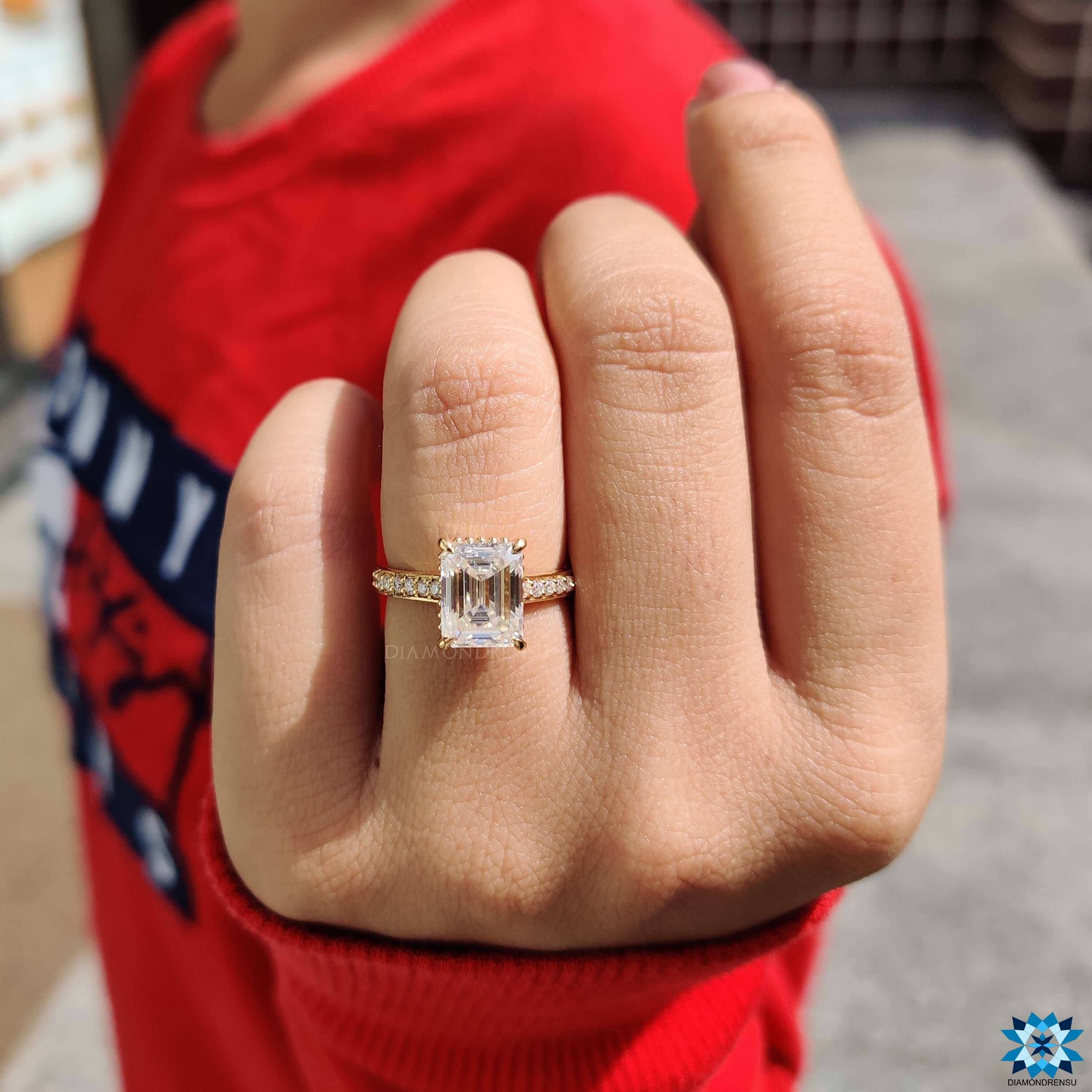 Handmade emerald moissanite ring with 4 claw prong and cathedral setting.