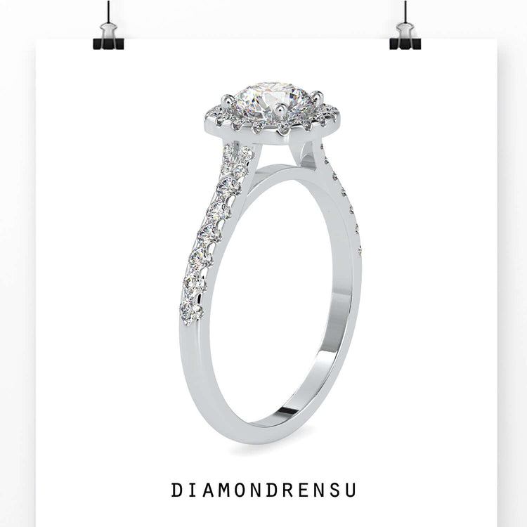 Pave diamond ring with round cut halo setting.
