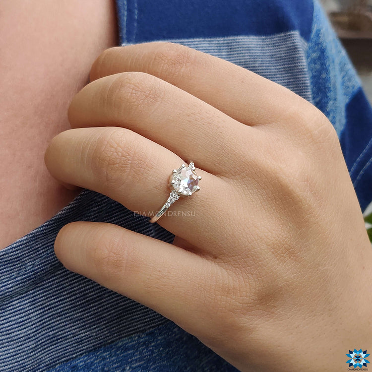 Handmade ring with round rose cut Moissanite set in white gold band.