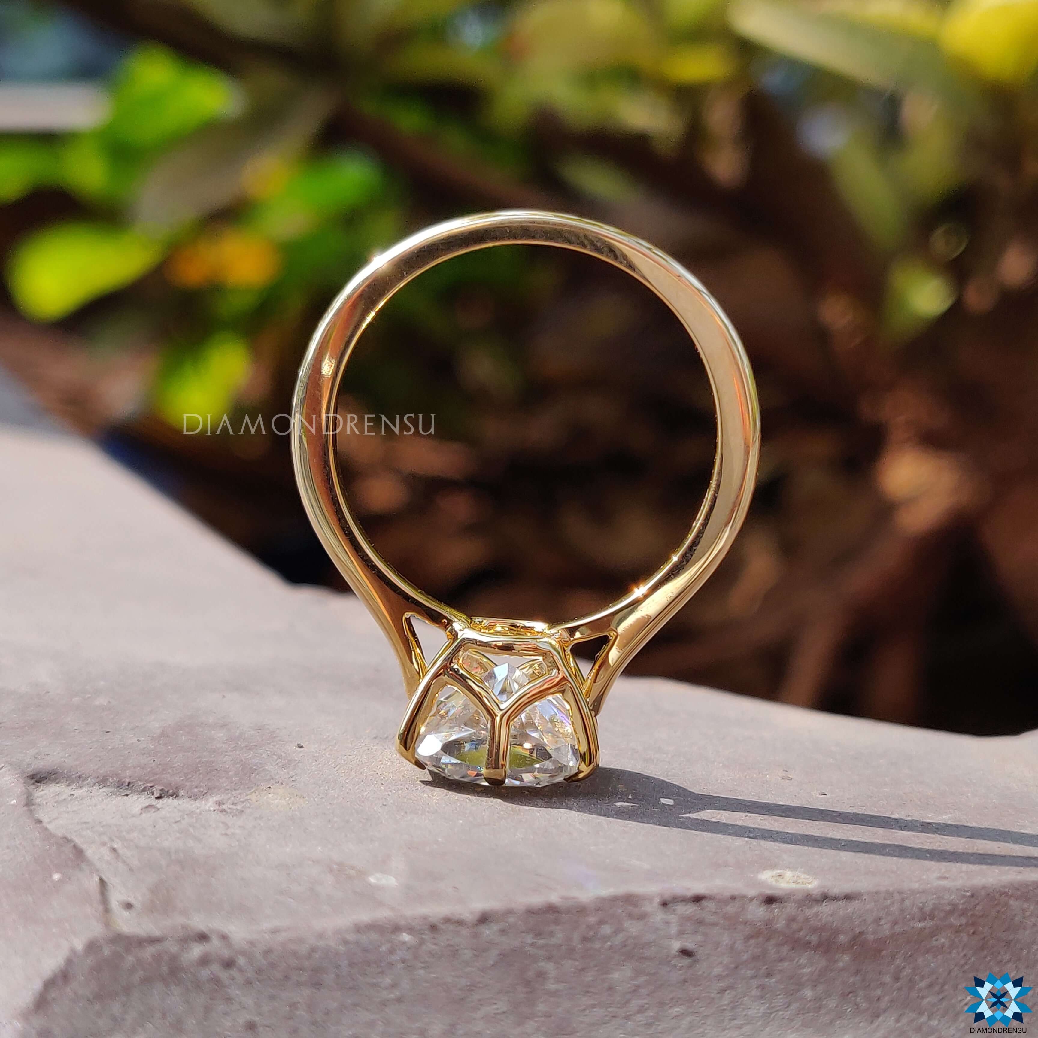 Buy yellow gold moissanite solitaire engagement ring.