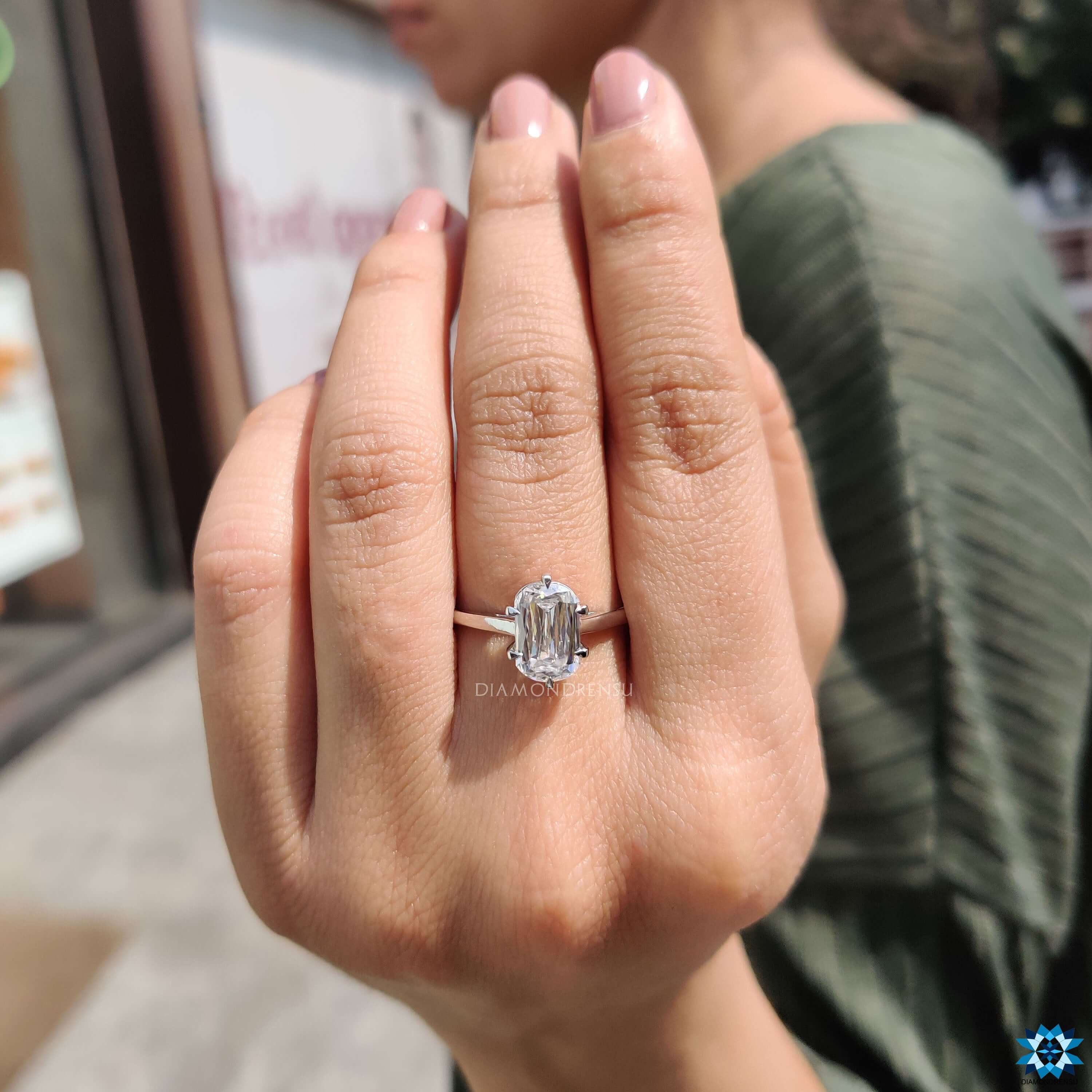 Handmade moissanite ring in cathedral setting.