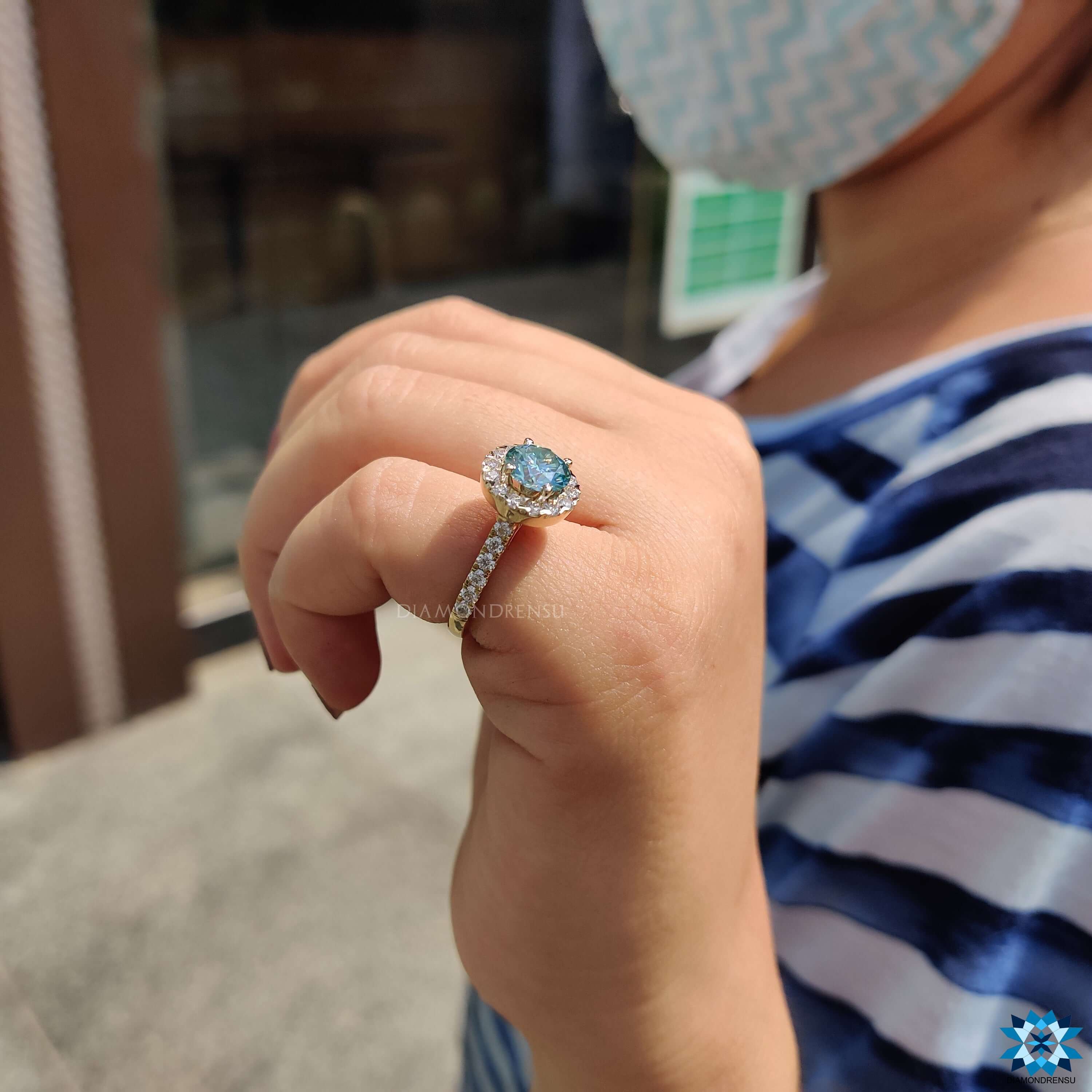 Handmade round moissanite ring with halo design.