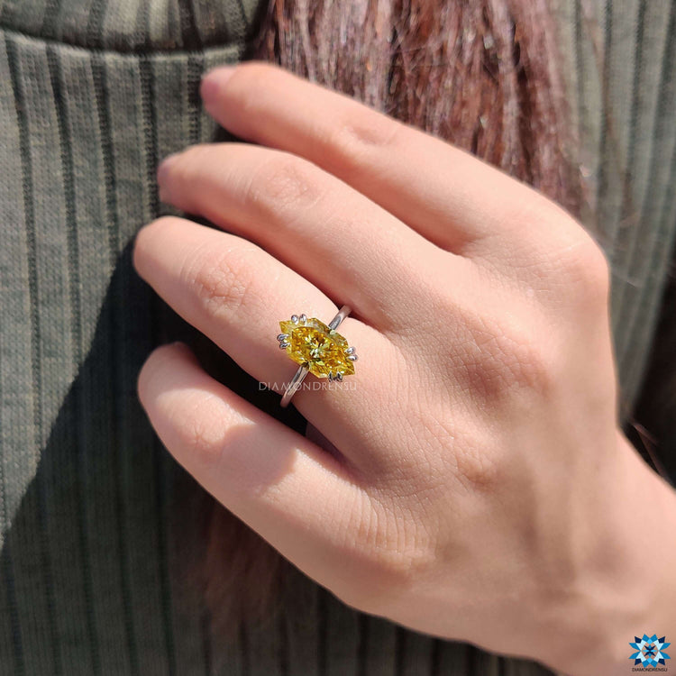 Canary yellow moissanite ring in solitaire setting.