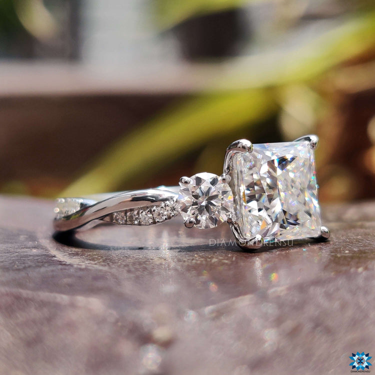 White gold moissanite ring with three stones.