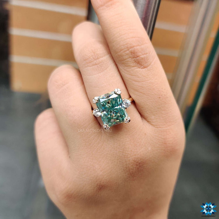 Radiant cut blue moissanite set in classic prongs.