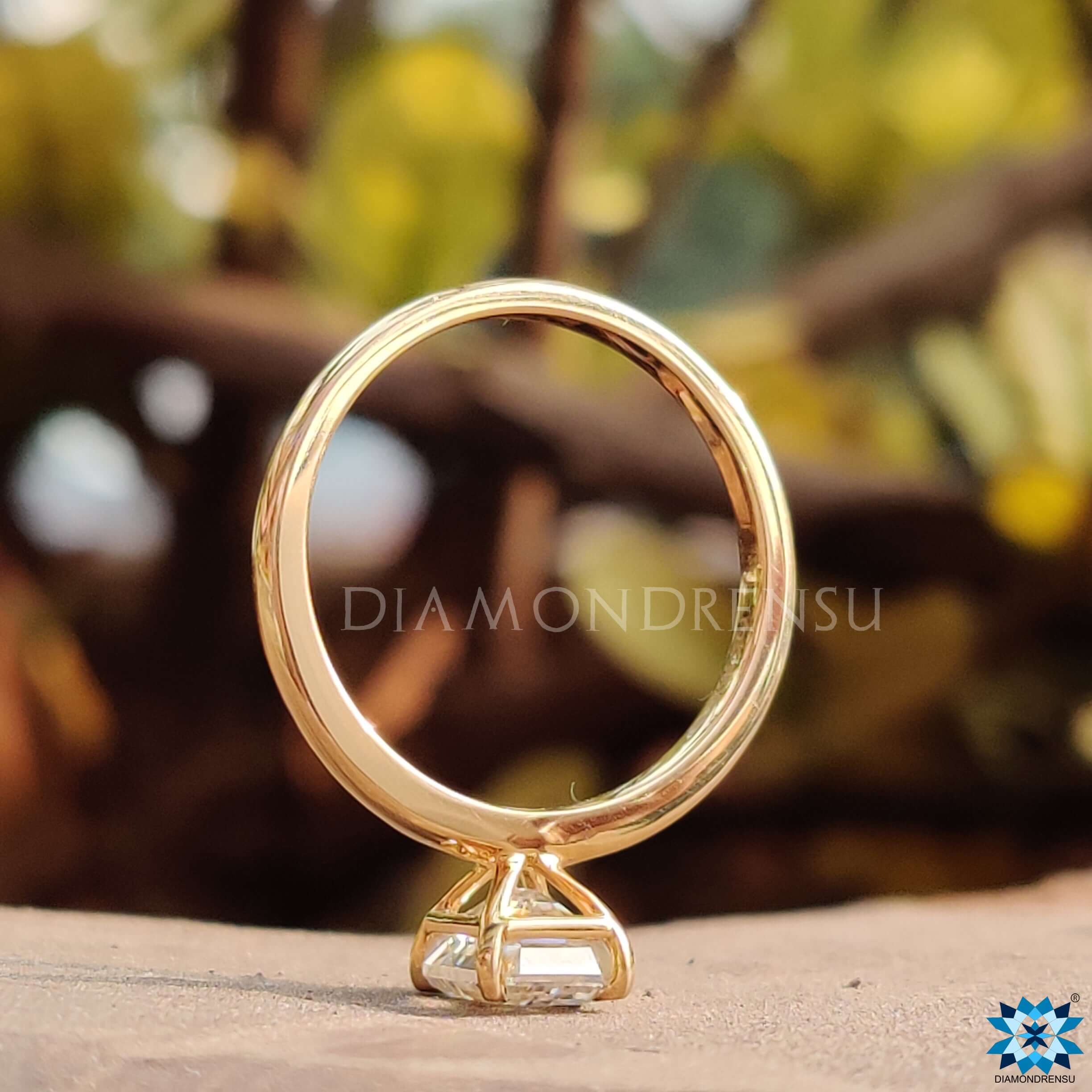 Yellow gold solitaire engagement ring.
