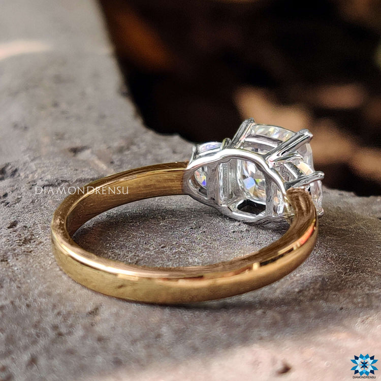 Custom engagement ring with cushion moissanite and side stones.