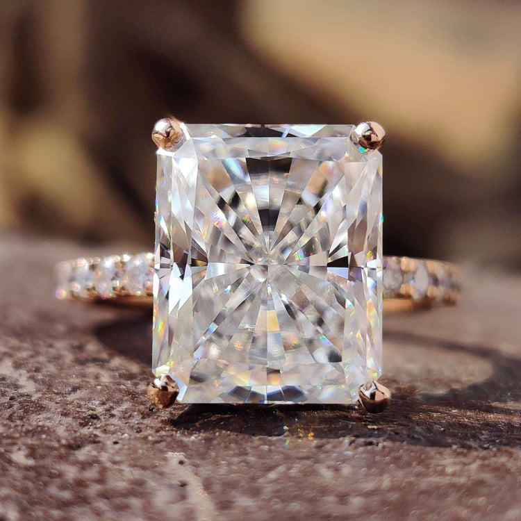 Radiant cut ring with hidden halo design.