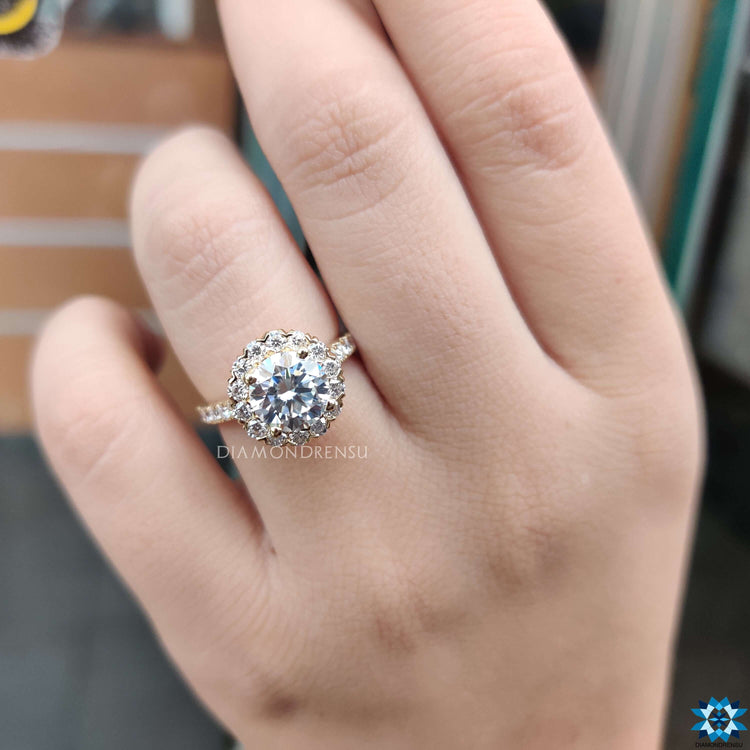 White gold ring with round cut moissanite center stone.