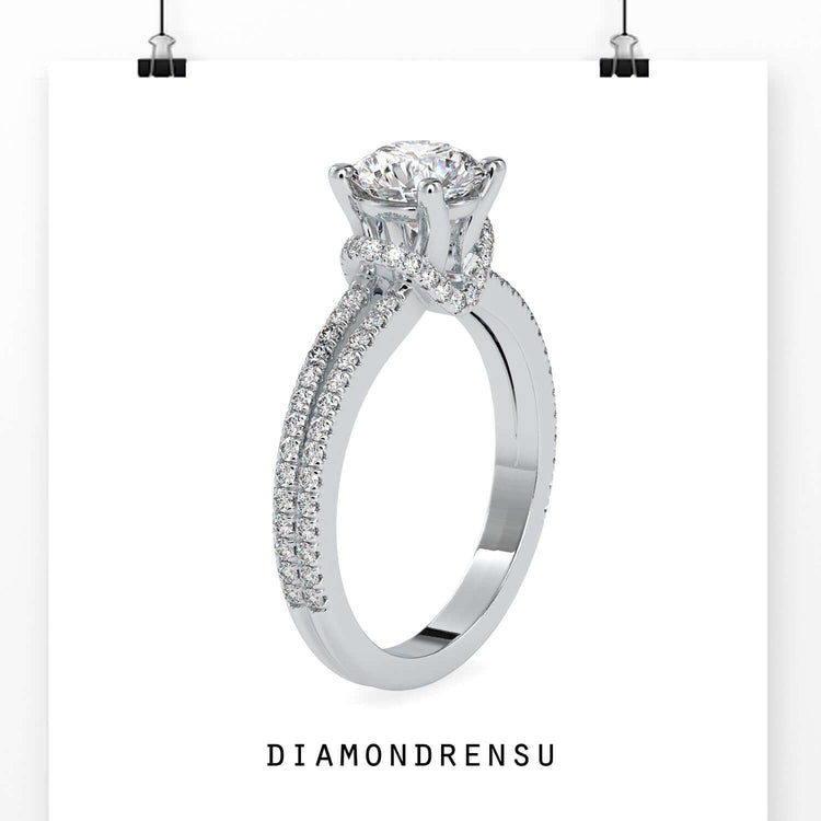 Designer ring in white gold with halo and split shank.