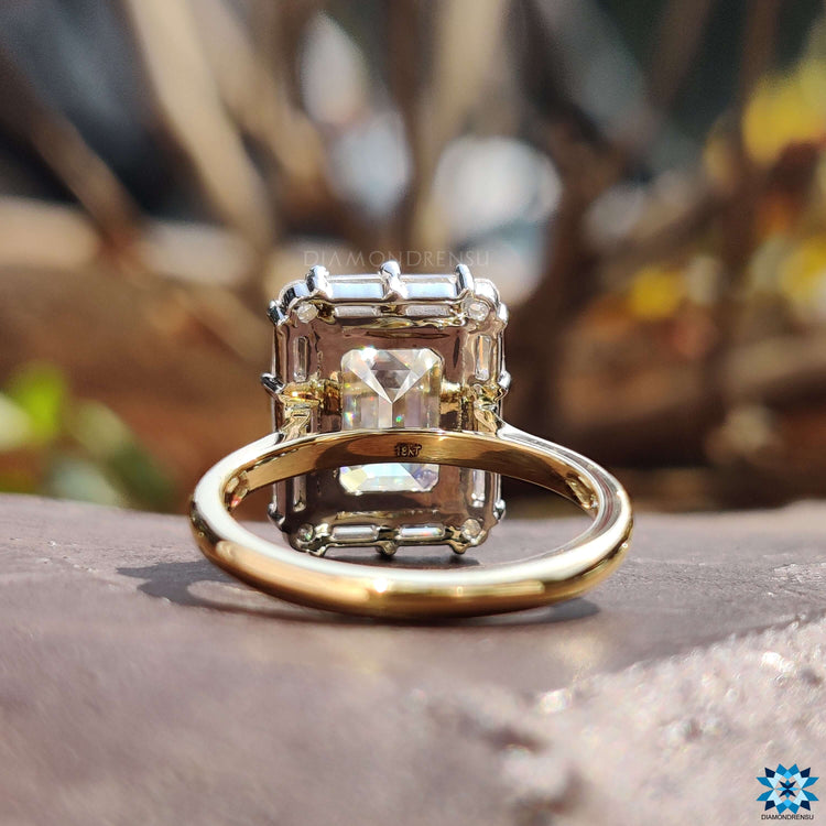 Prong setting ring with emerald cut moissanite.