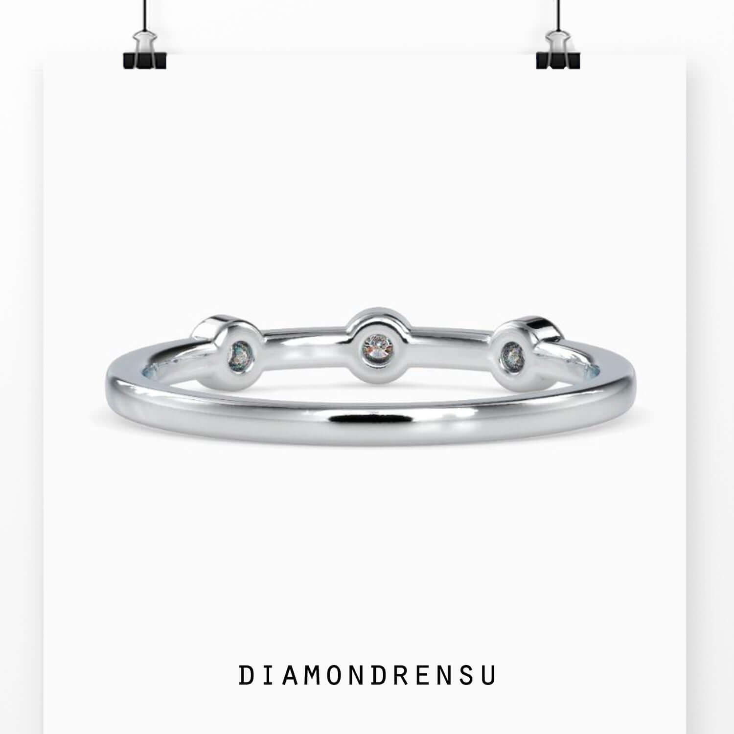 UK diamond wedding band with bezel setting style.