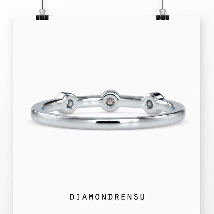 UK diamond wedding band with bezel setting style.