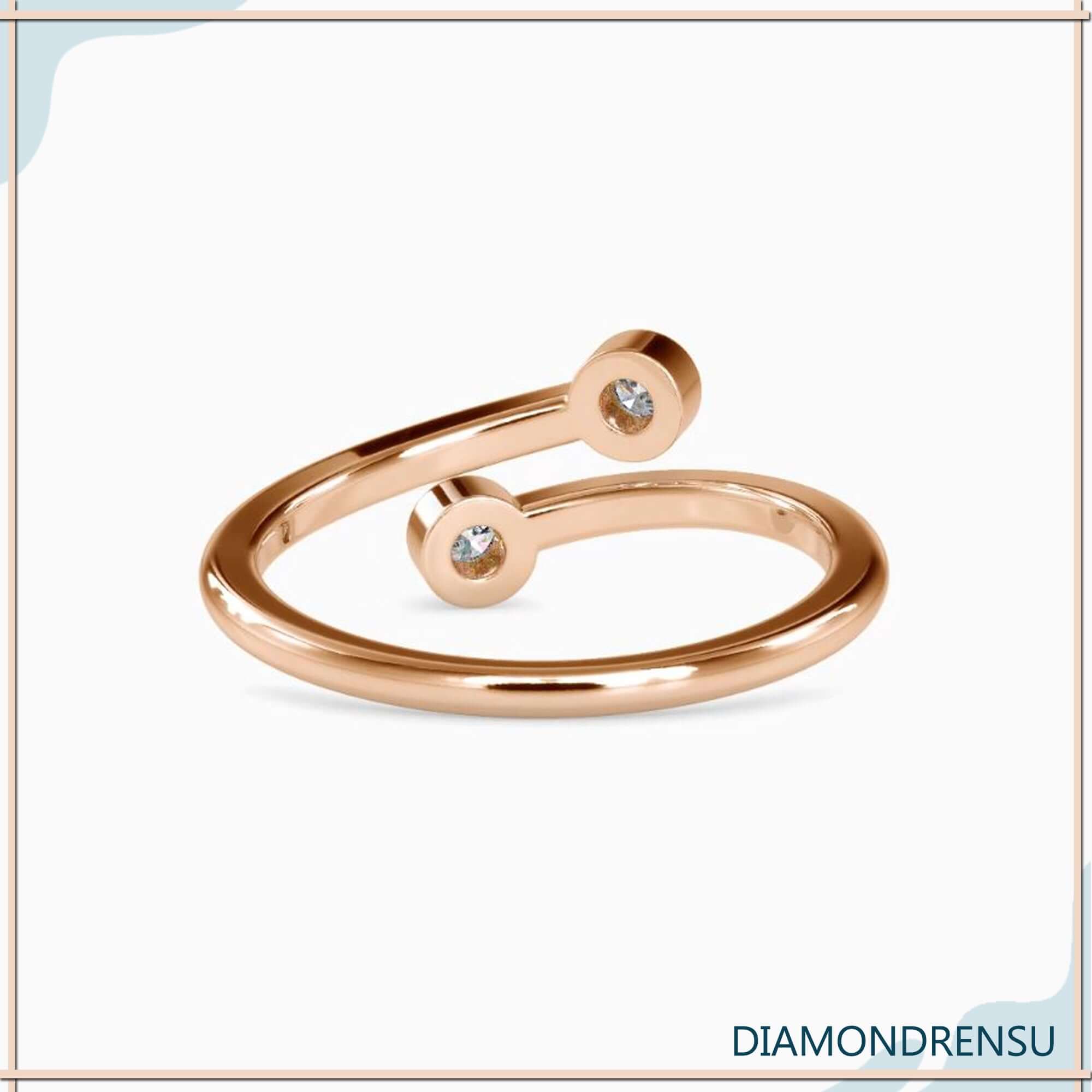Rose gold open gap ring with bezel set diamonds.