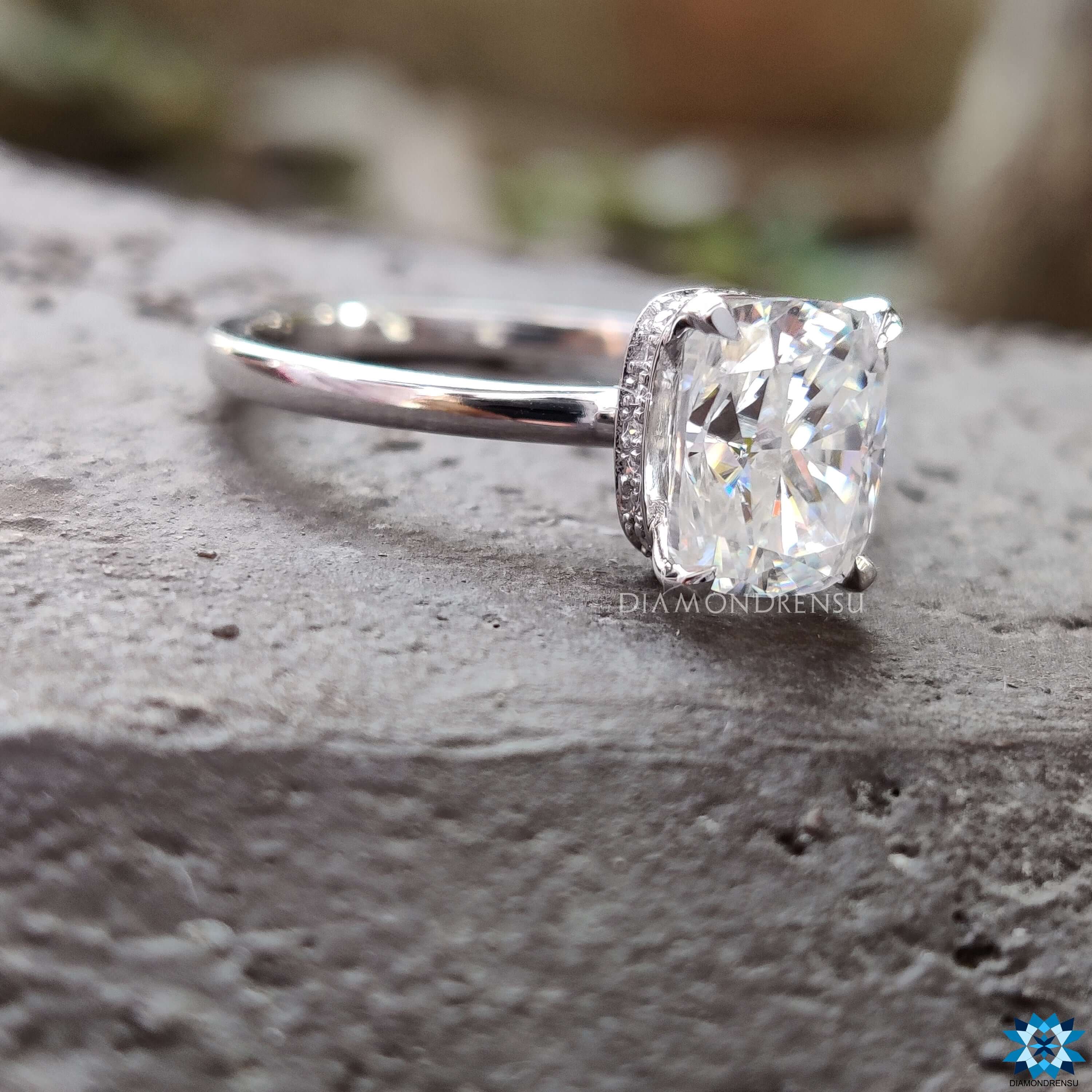 Four claw prong moissanite engagement ring.