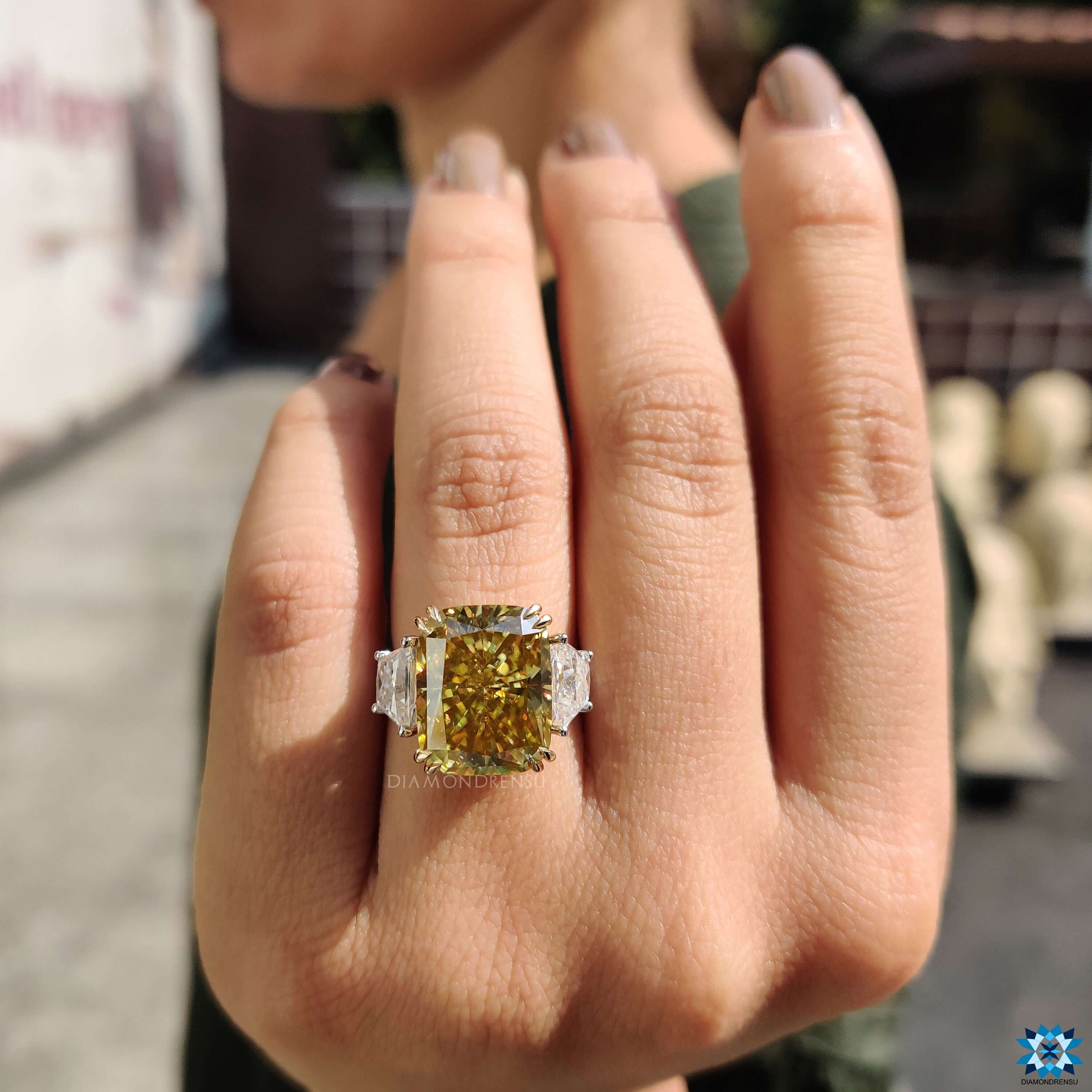 Radiant cut canary yellow moissanite as the center stone.