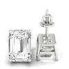Emerald cut diamond stud earrings with prong setting in white gold.