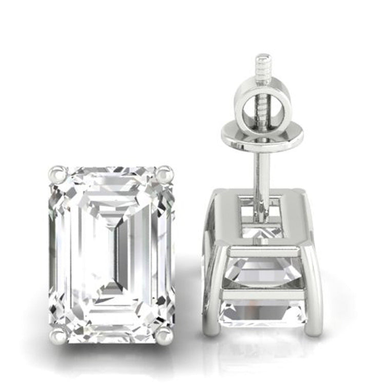 Emerald cut diamond stud earrings with prong setting in white gold.