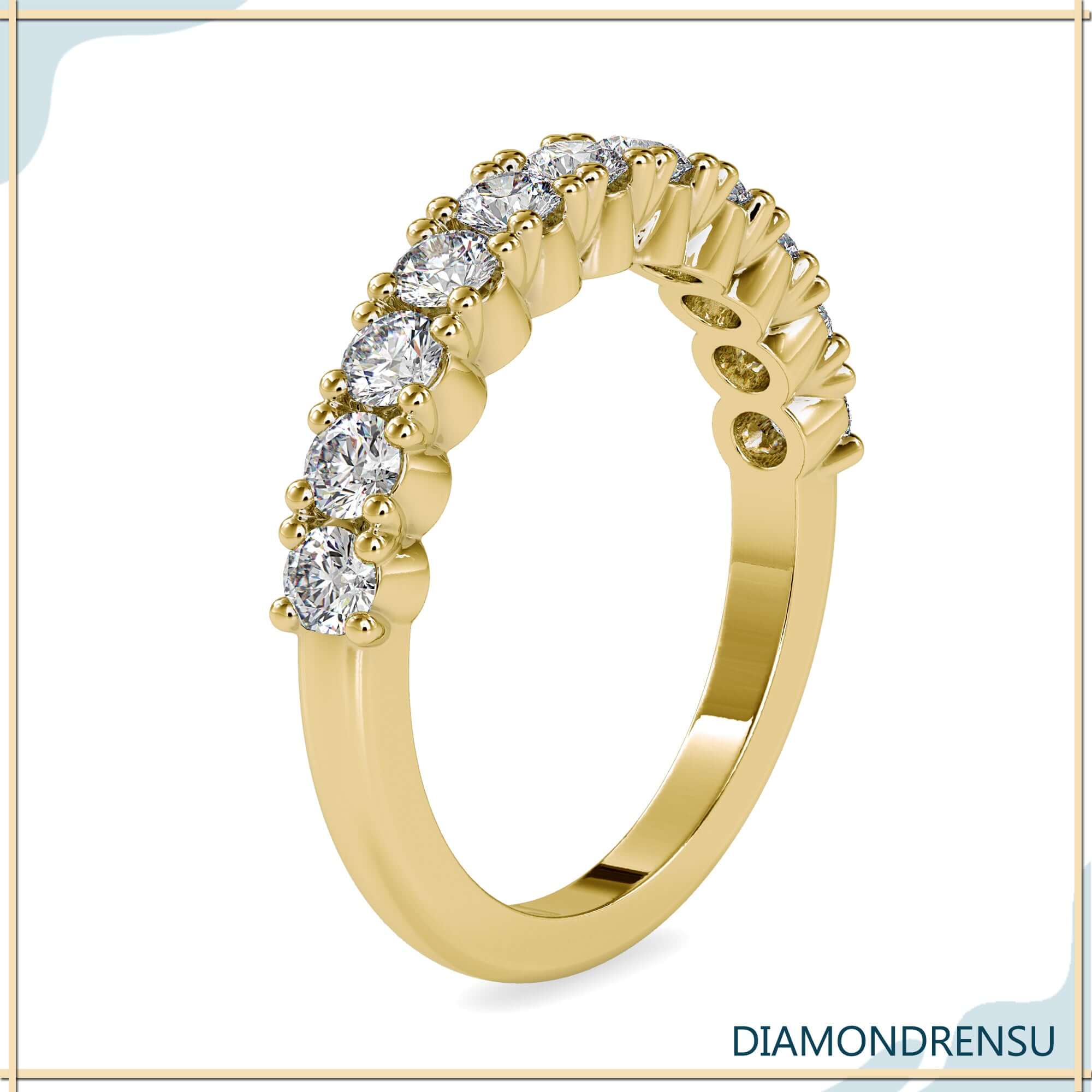 Round cut half eternity band with clean gold finish.