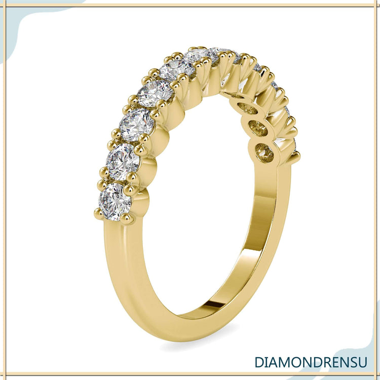 Round cut half eternity band with clean gold finish.