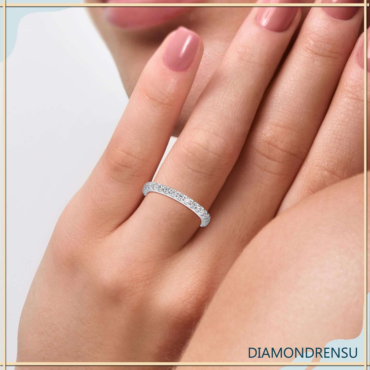Prong set 3/4 eternity wedding band in rose gold finish.