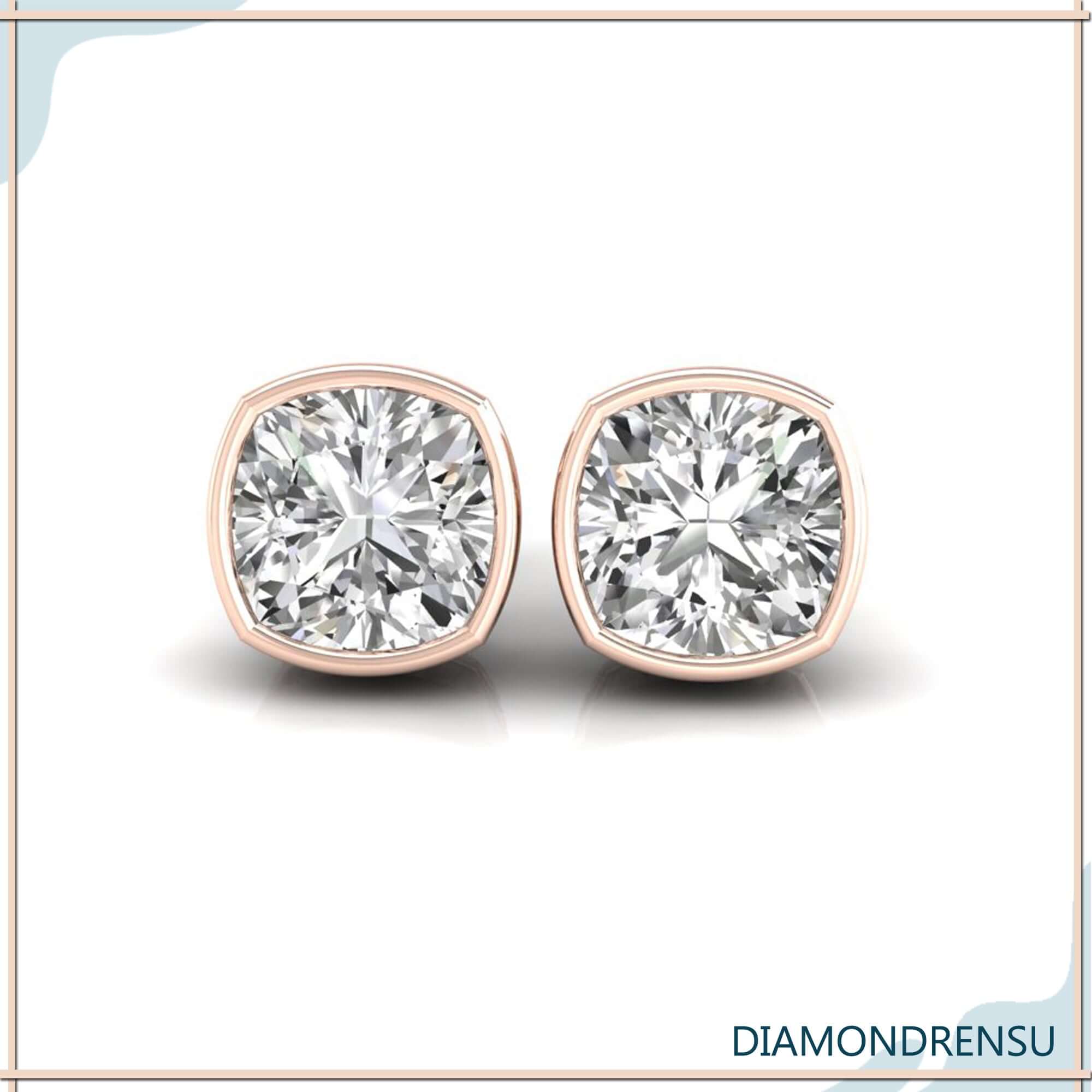 Rose gold cushion cut diamond earrings with bezel mount.