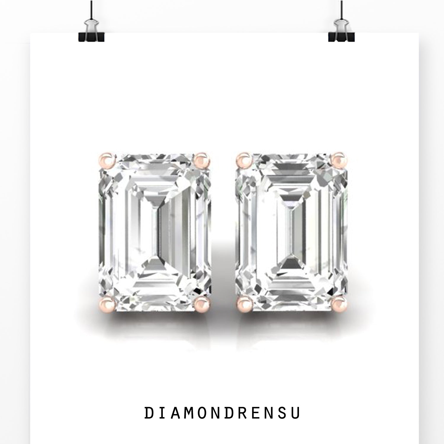 Lab grown diamond earrings with emerald step cut stones and prong setting in white gold.