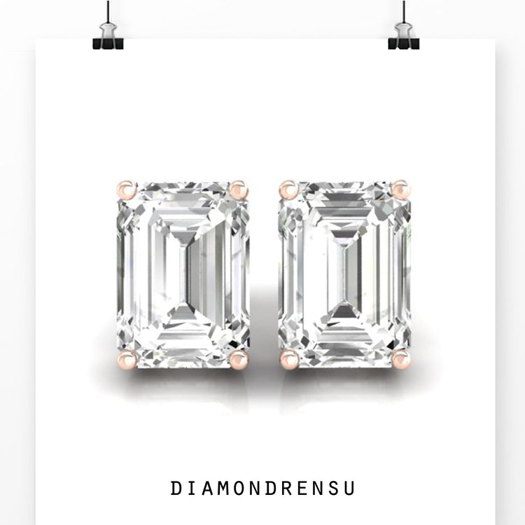 Lab grown diamond earrings with emerald step cut stones and prong setting in white gold.