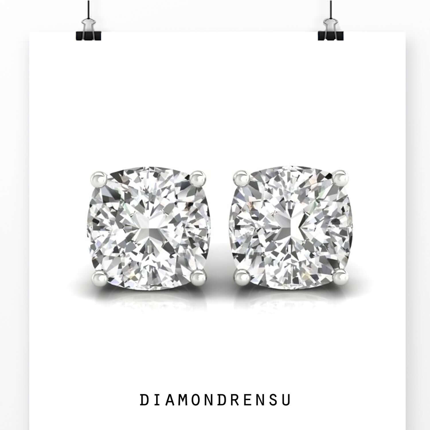 White gold cushion studs with four claw settings.
