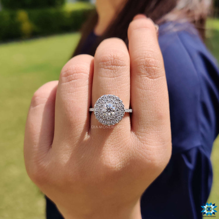 Round cut moissanite ring with pave setting.