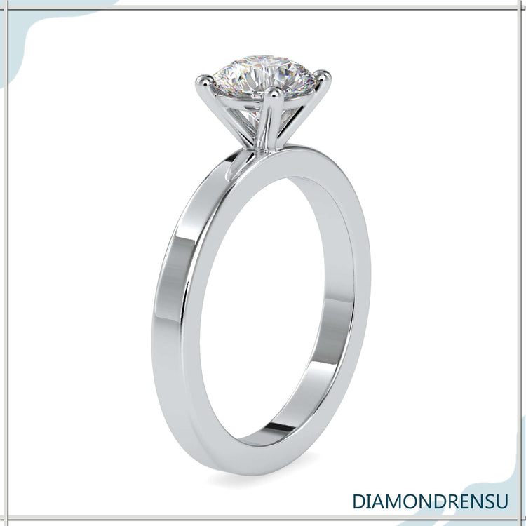 Handmade ring with solitaire diamond in yellow gold.
