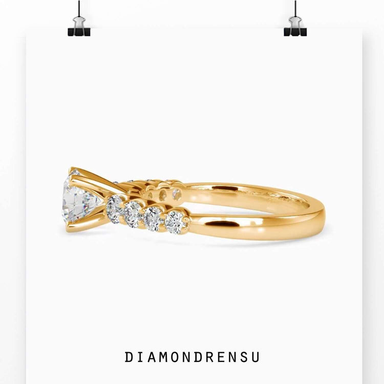 Simple diamond ring with round brilliant lab grown stone and pave band.