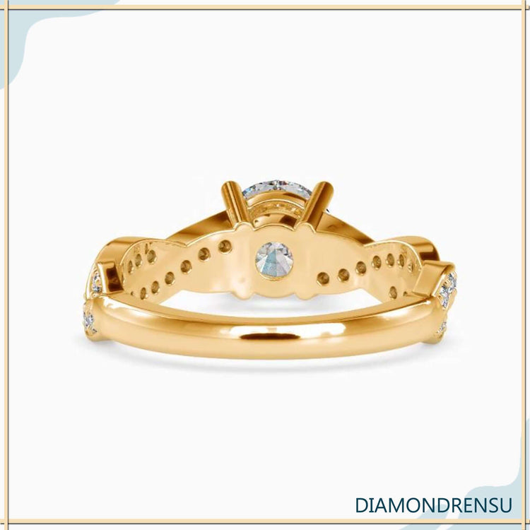 White gold diamond ring with twisted band and handmade finish.