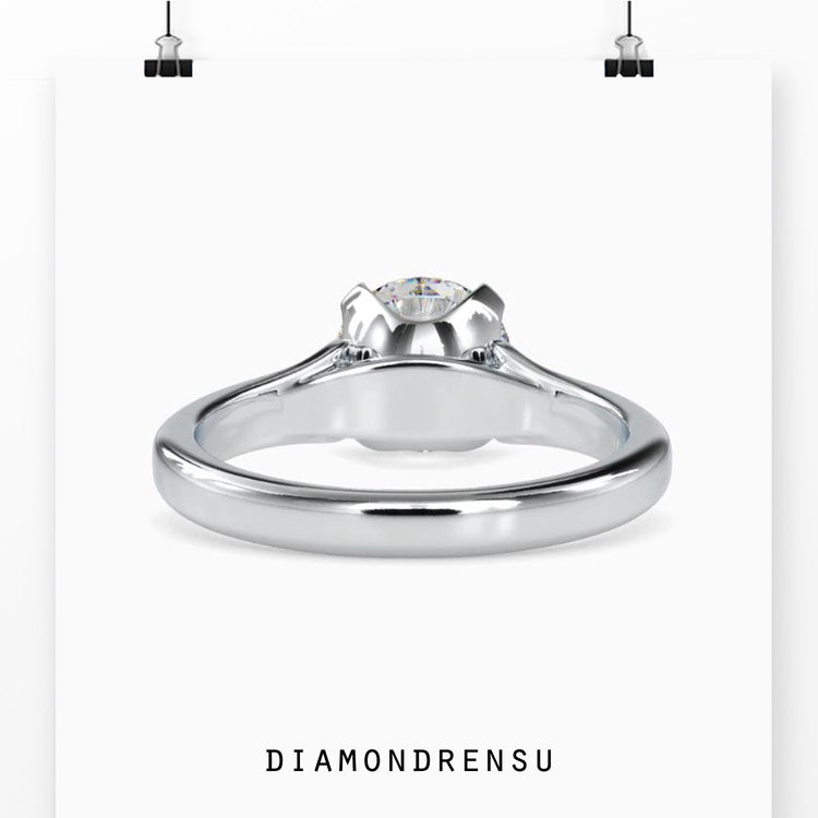 Yellow gold diamond ring with 4 prong round cut design.