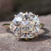 Cushion old mine cut moissanite engagement ring in yellow gold.