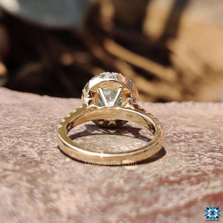 Custom engagement ring with cyan blue moissanite.