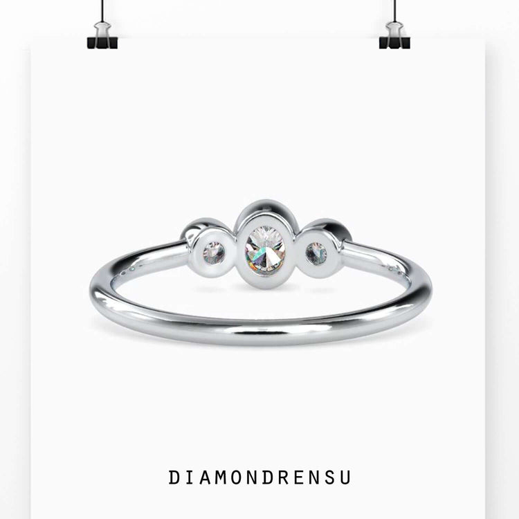 Lab diamond ring with oval cut centre and round accents.