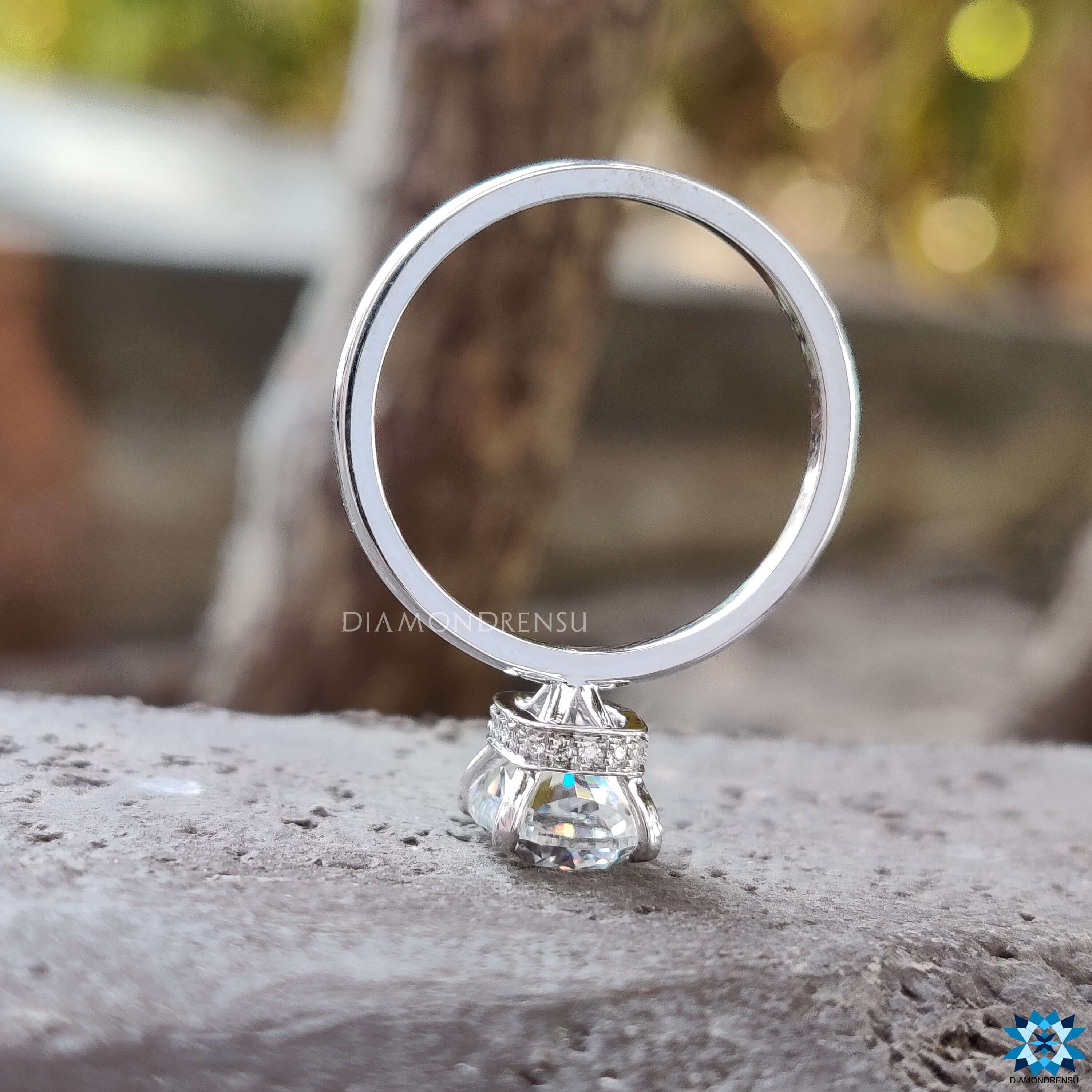 Moissanite ring featuring hidden halo and prong setting.