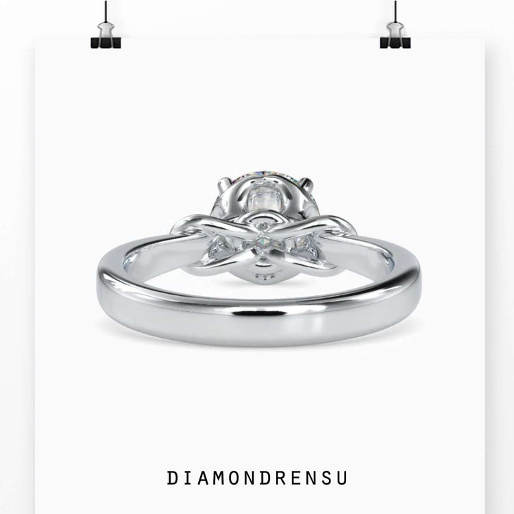 Handmade ring with round prong setting and hidden infinity loop.